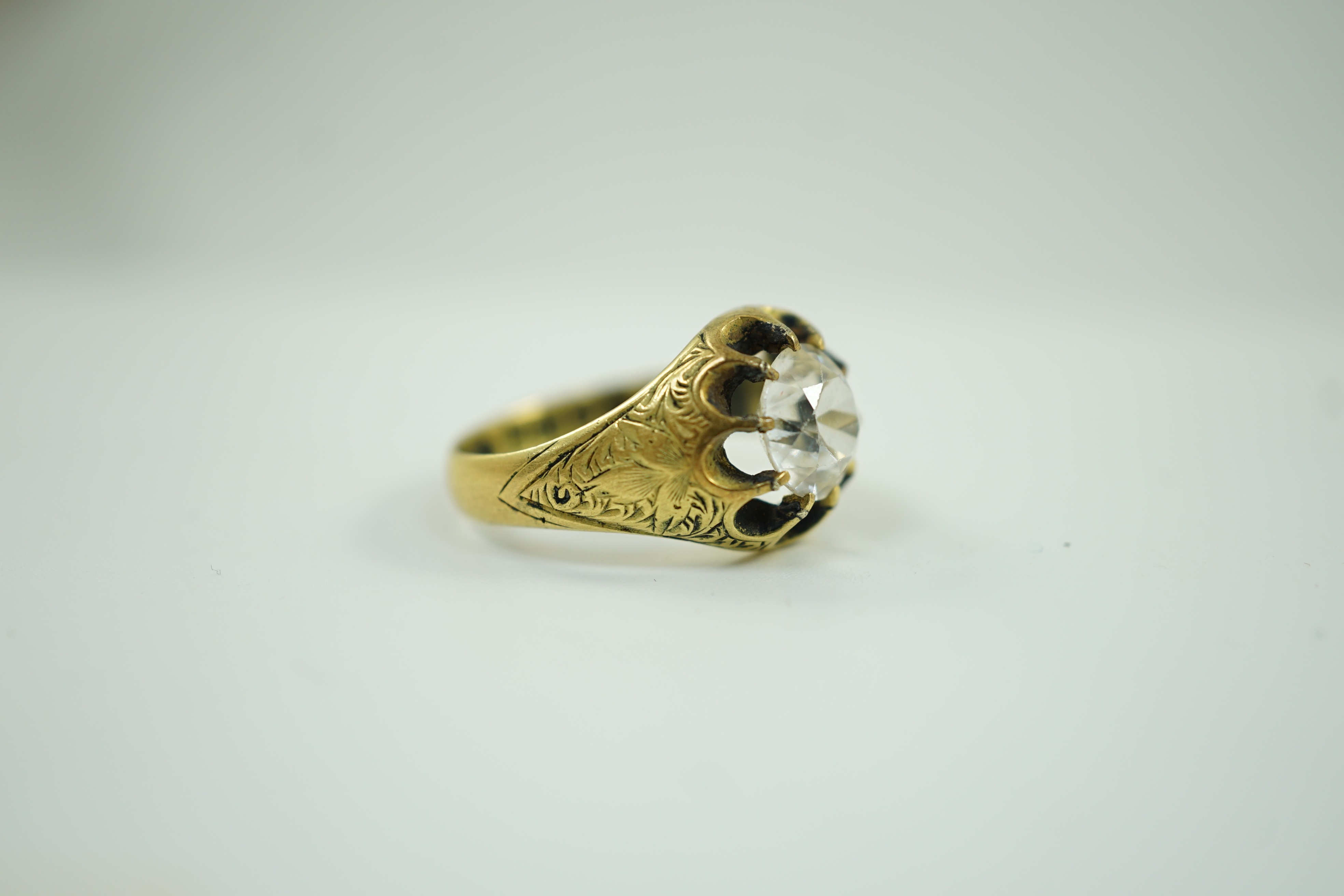 An Edwardian 18ct gold and single stone claw set white zircon? ring, size O, size 7 grams.